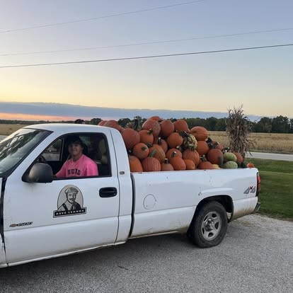 A truck bed full of fresh-picked pumpkins